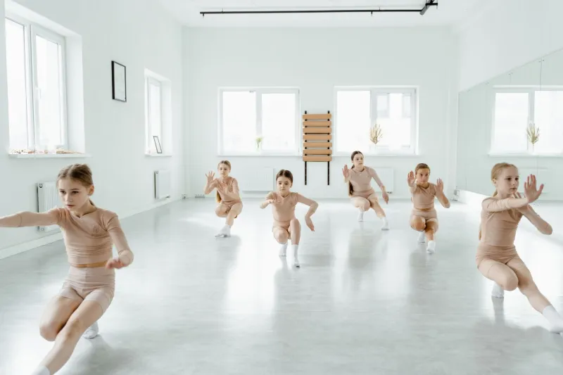 Behind the Formation: Ensemble Dancers Are Building Visual Worlds the Spotlight Never Reaches